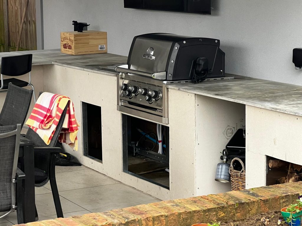Residential outdoor kitchen area with gas-powered BBQ