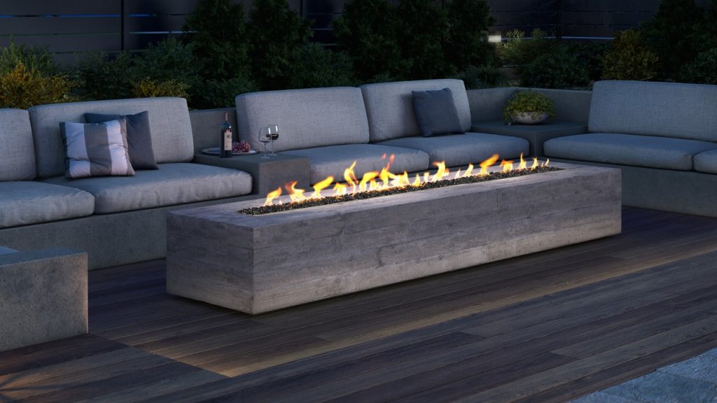 Garden seating area by night with elegant gas-powered fire pit